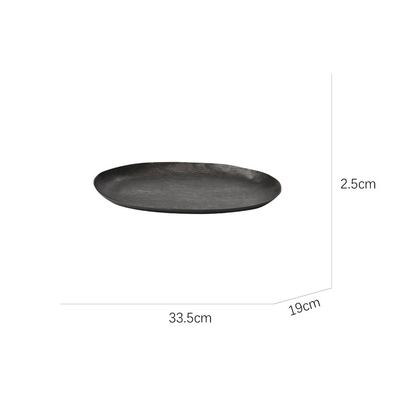 Oval aluminum fruit tray in gold and black