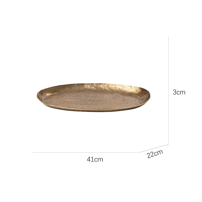 Oval aluminum fruit tray in gold and black