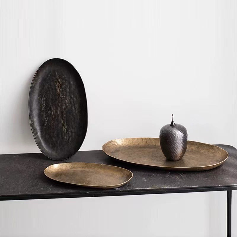 Oval aluminum fruit tray in gold and black