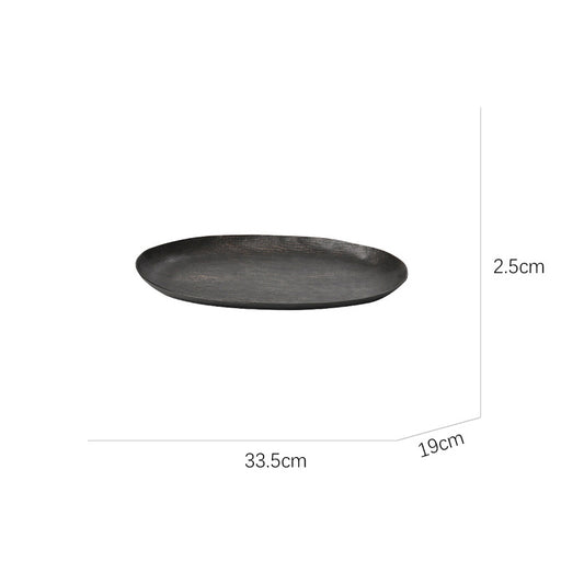 Oval aluminum fruit tray in gold and black
