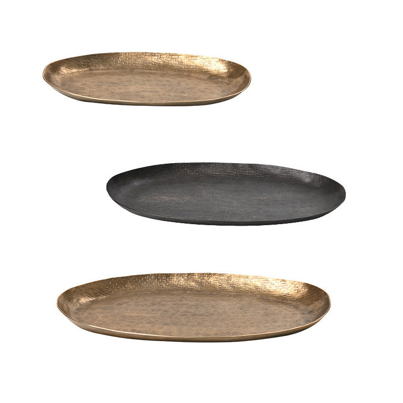 Oval aluminum fruit tray in gold and black