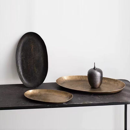 Oval aluminum fruit tray in gold and black