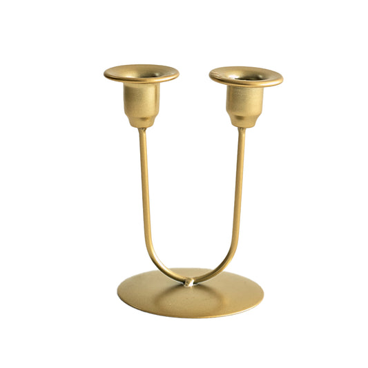Romantic candlelit dinner set with artistic wrought-iron candle holders as decorative accents