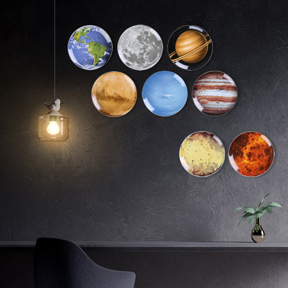 Creative wall decor: modern ceramic wall hanging featuring a space planet and astronaut design for the living room