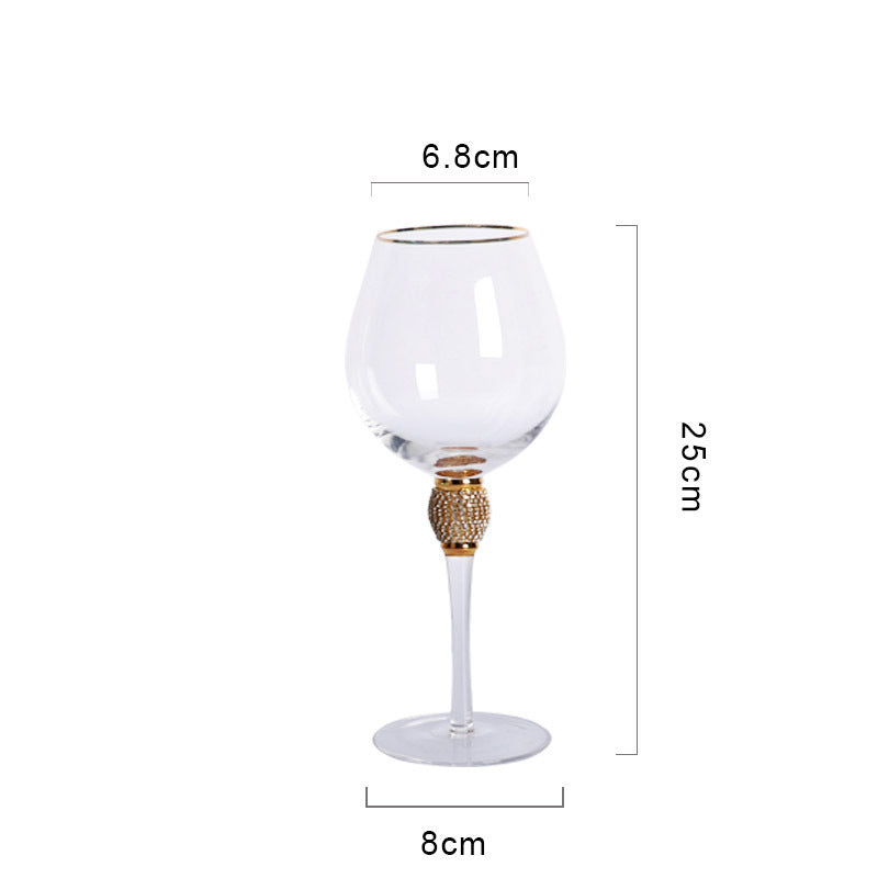 Elegant glass stemmed cup with diamond inlays and gold trim