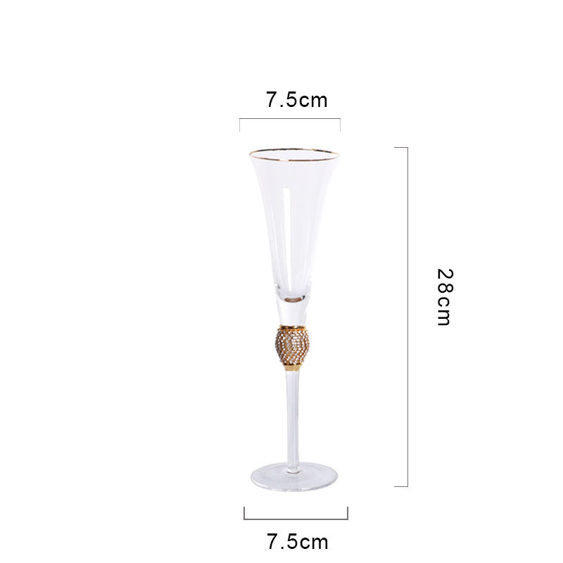 Elegant glass stemmed cup with diamond inlays and gold trim