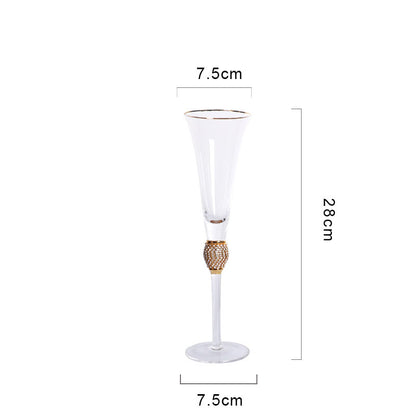 Elegant glass stemmed cup with diamond inlays and gold trim