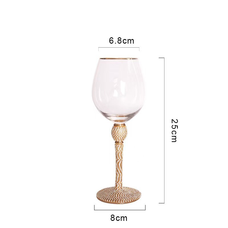Elegant glass stemmed cup with diamond inlays and gold trim